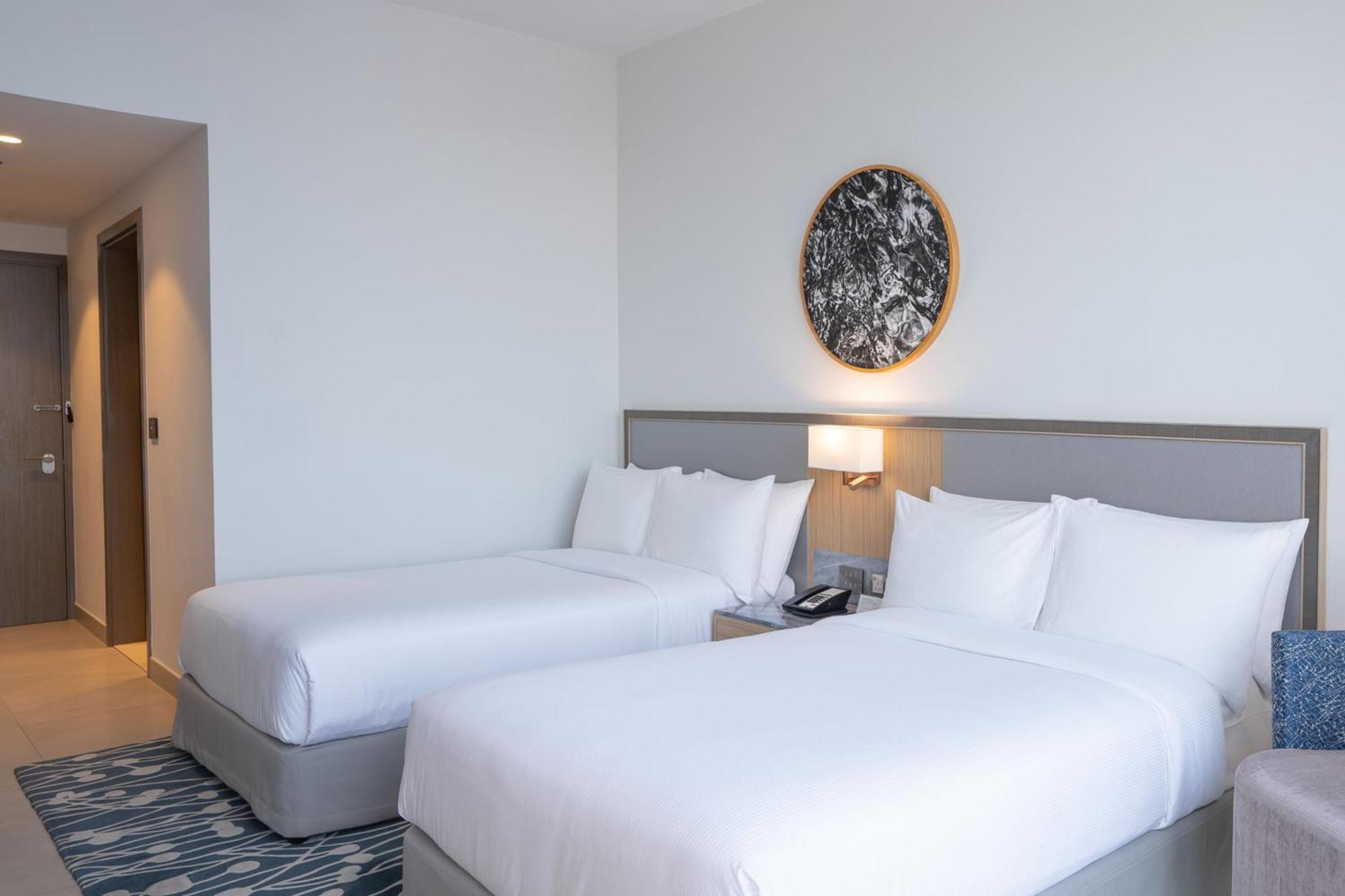 The First Collection Dubai Jumeirah Village Circle, A Tribute Portfolio Hotel Exterior foto Two single beds in a hotel room